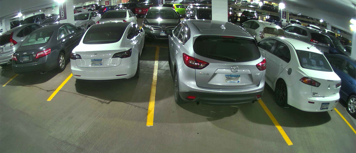 Real-time video screenshot from M5 sensor displaying clear view between parked cars.