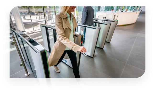 Image showing individual walking through a speed gate with integrated security solutions.