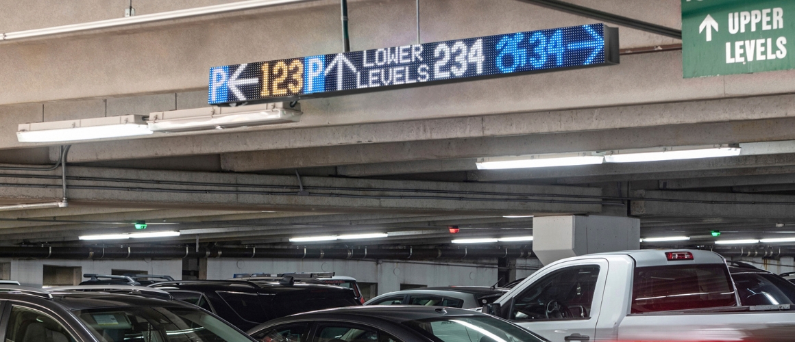 Parking guidance system VMS sign with 123 spaces left, 234 spaces on the upper levels, 34 ADA right.
