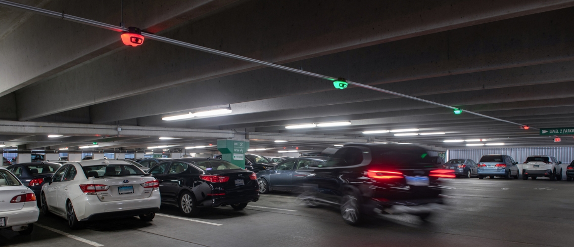 Vehicle parking under a row of camera-based M5 smart sensors at Colorado School of Mines.