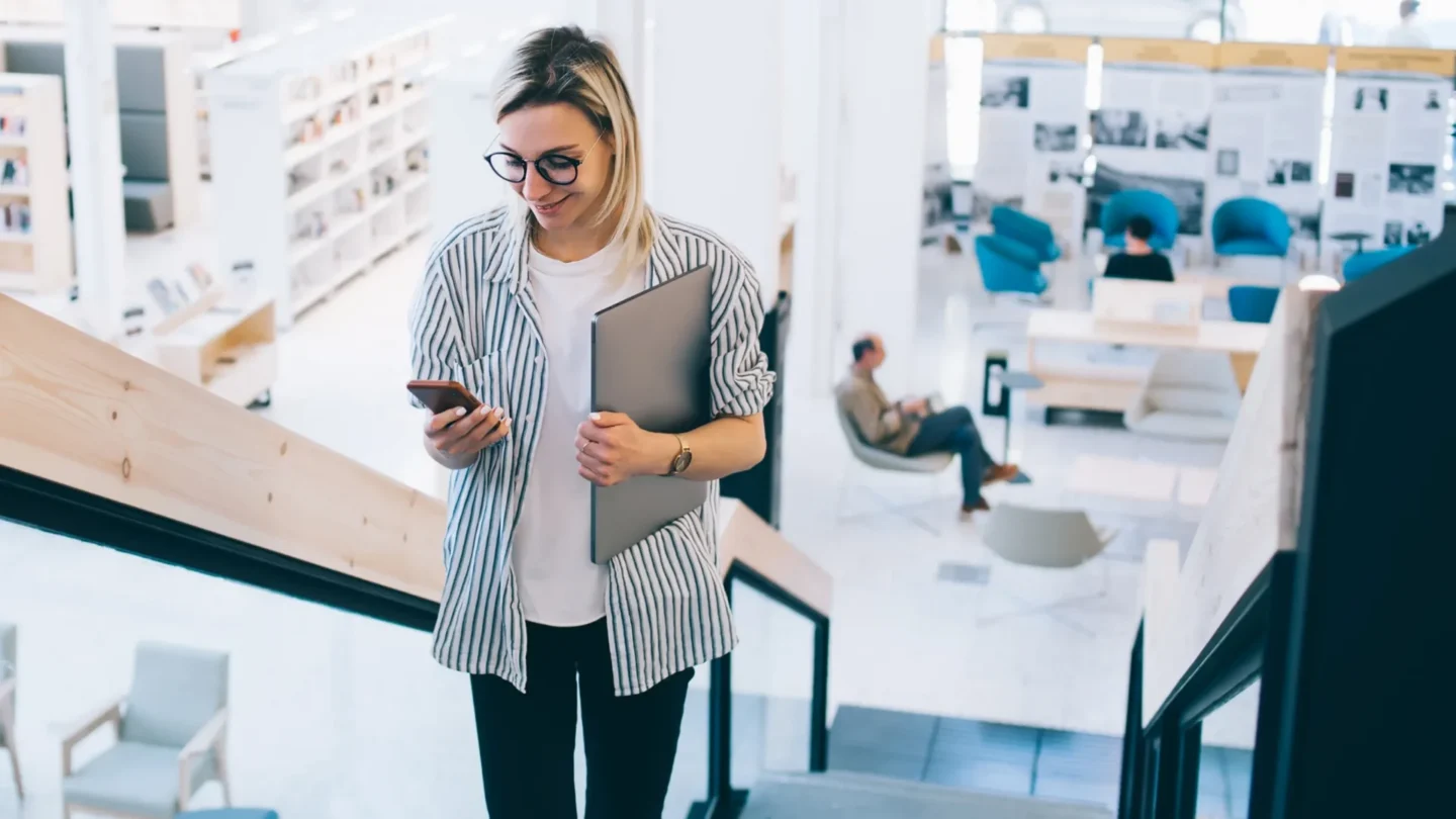 Tenant manager using ATLAS to check access on a smartphone while walking through an office building