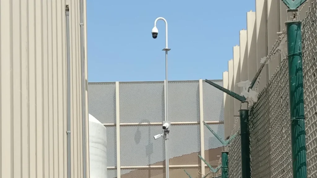 Surveillance camera on an industrial building achieving optimal surveillance in complex environments