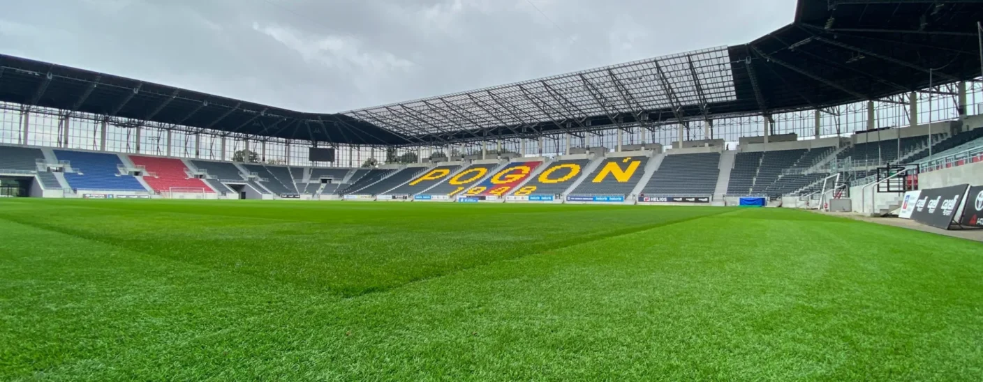 Pogoń Szczecin Stadium football pitch and stands showcasing a modern sports venue