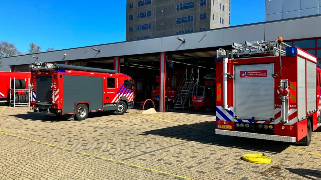 Fire trucks parked outside Haaglanden fire station equipped with security management solutions from IPROTECT