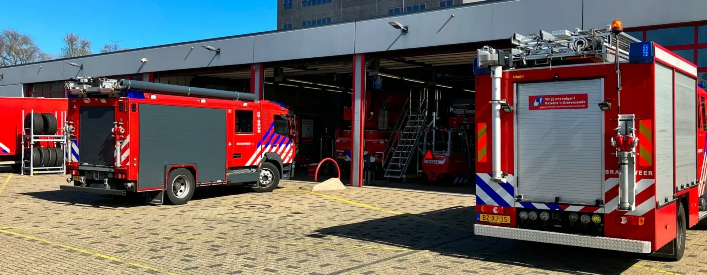Fire trucks parked outside Haaglanden fire station equipped with security management solutions from IPROTECT