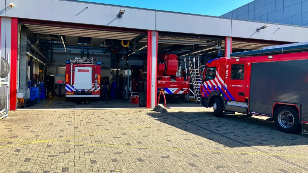 Fire trucks inside Haaglanden fire station garage with controlled access systems from IPROTECT