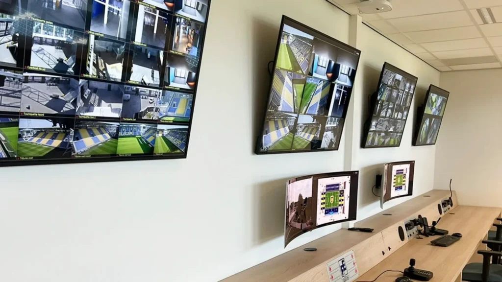Control room with multiple surveillance screens displaying footages from VDG SENSE Video Management System at SC Cambuur Kooi Stadion