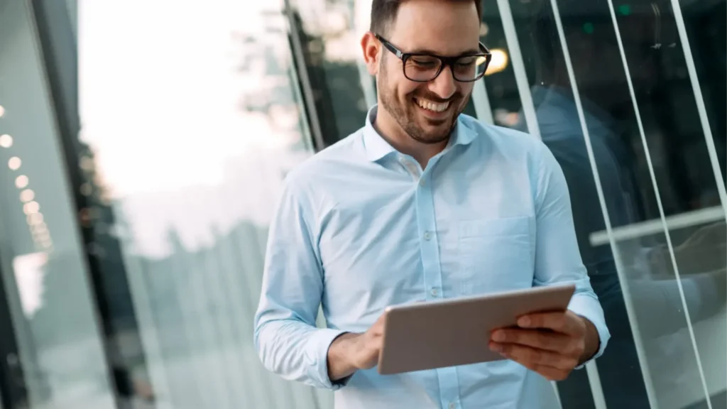 Corporate and commercial sector man using a tablet for security management solutions
