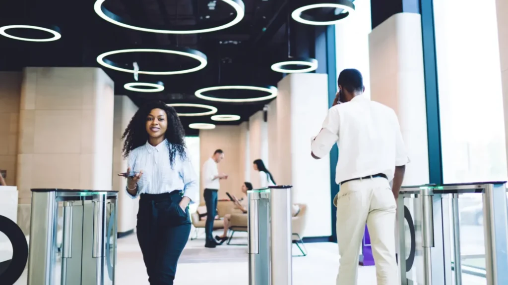 People in the corporate and commercial sector passing through an access control gate for security management